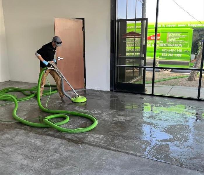 Technician performing a Floor Cleaning 